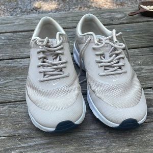 Nike Womens rose gold/champagne athletic shoe